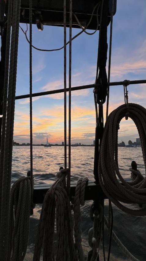 New York Harbor at sunset seen through the rigging of the Pioneer schooner